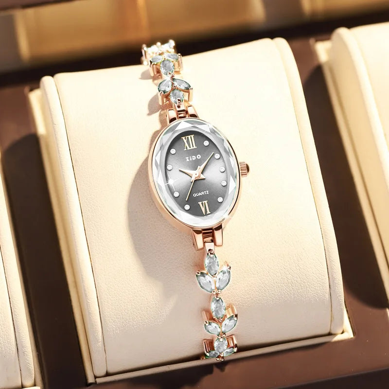 Montre pour femmes, de luxe , sertie de diamants, avec motif trèfle, montre ovale imperméable.